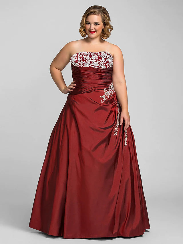 Elegant plus size strapless taffeta ball gown with beading appliques.