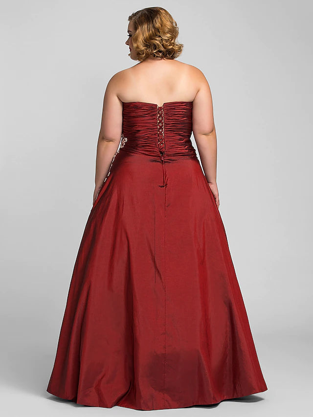 Full length view of plus size strapless formal dress.