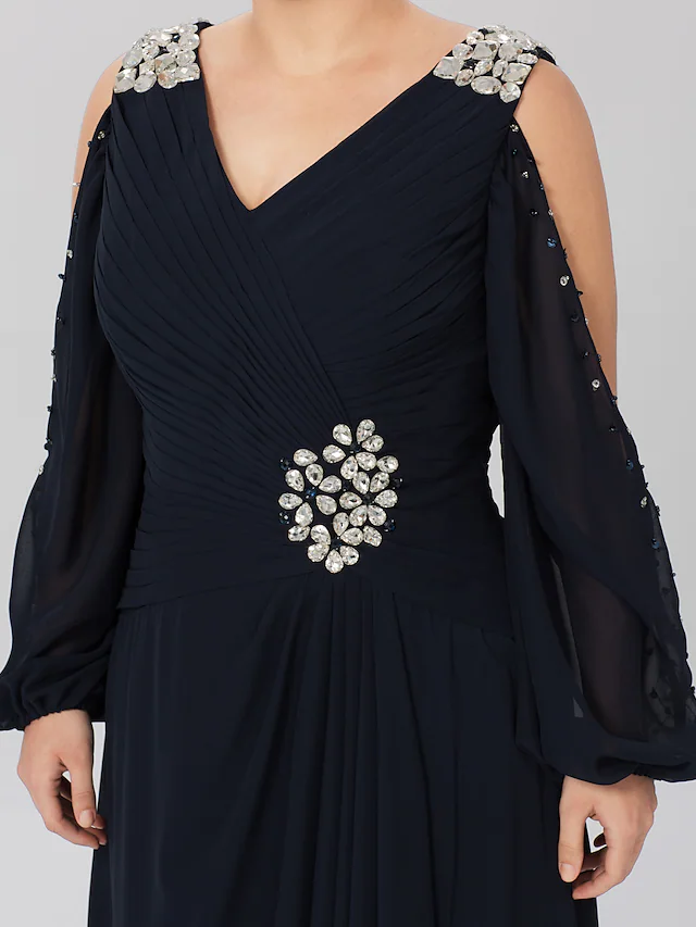 Detail of the long sleeve and stretch satin fabric on a formal gown.