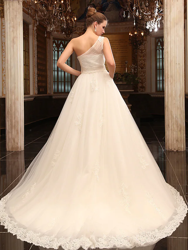 Close-up of the one-shoulder satin bodice on the wedding dress.