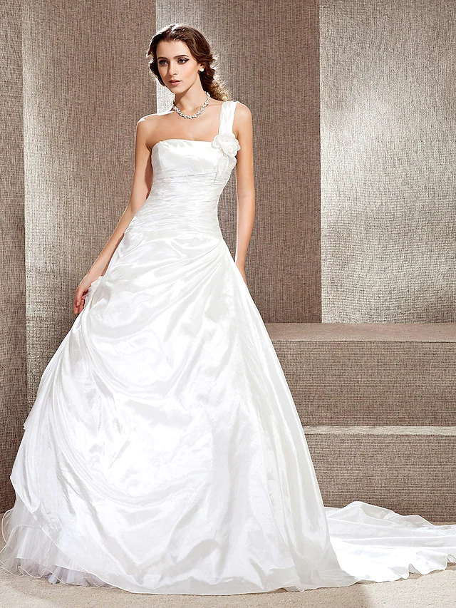 Princess A-line wedding dress with one shoulder neckline and cathedral train.