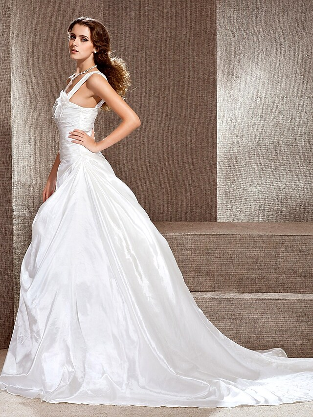 Back view of taffeta wedding gown showing cathedral train.