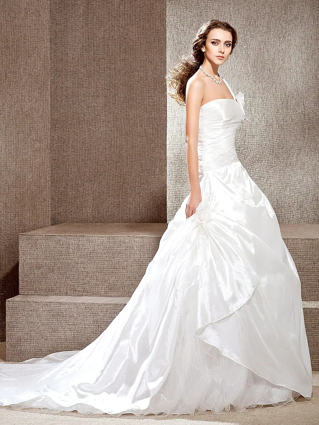 Side view of elegant one-shoulder bridal dress.