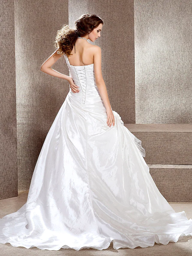 Close-up of taffeta fabric on A-line wedding dress.