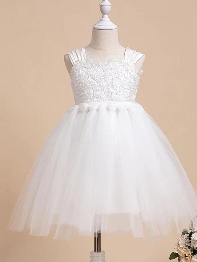 Princess knee-length flower girl dress with a bow, worn by a young girl.
