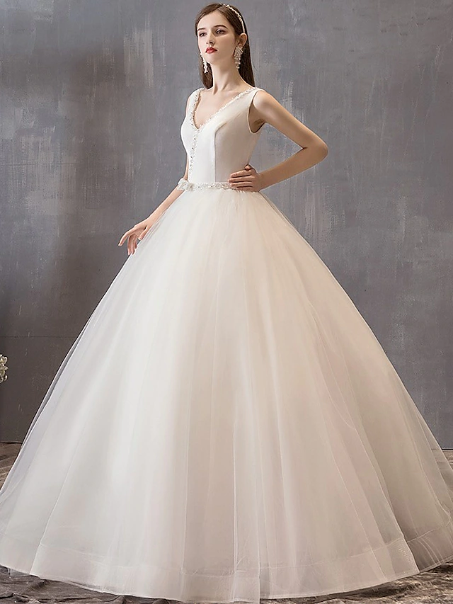 Back view of the princess ball gown showing the voluminous tulle skirt and bow embellishment.