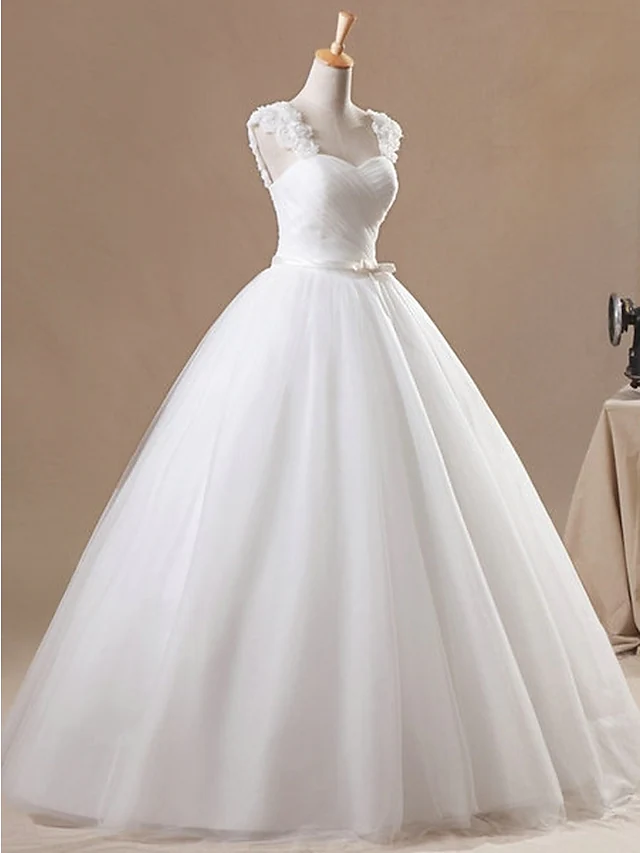 Back view of a floor-length chiffon and tulle wedding gown.