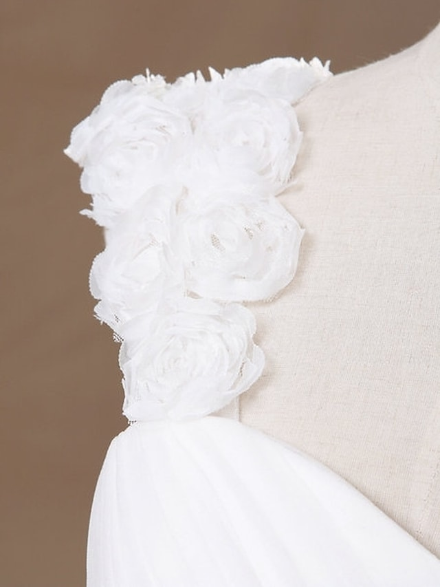 Side view of a sleeveless formal wedding dress.