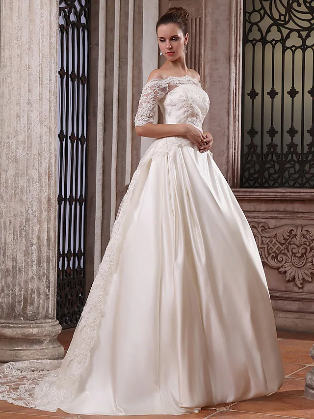 Back view of the white satin ball gown wedding dress, showing the court train detail.