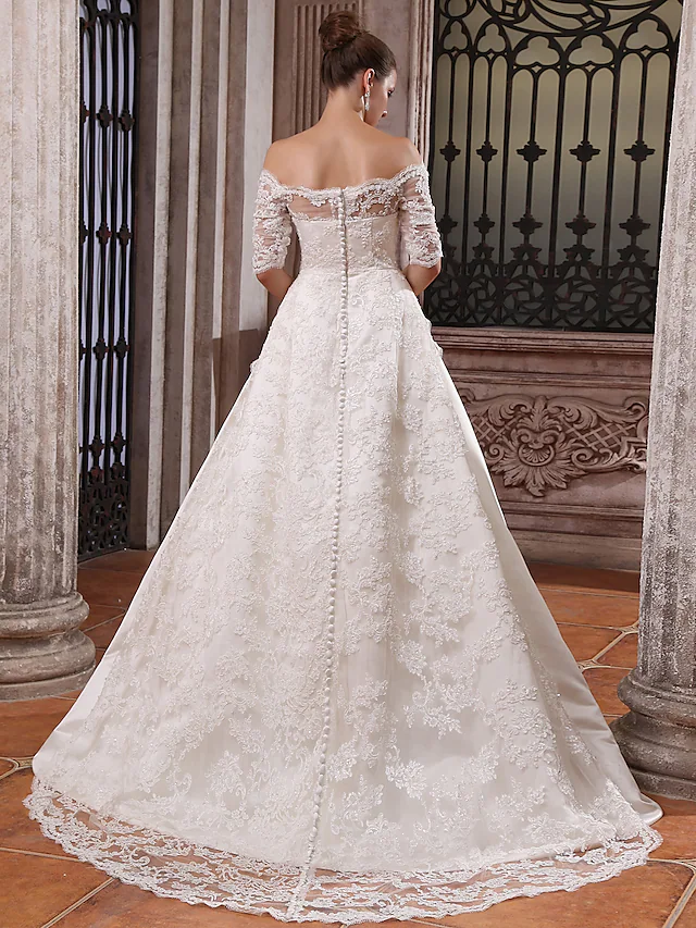 Side profile of the white satin wedding dress, highlighting the off-shoulder design.