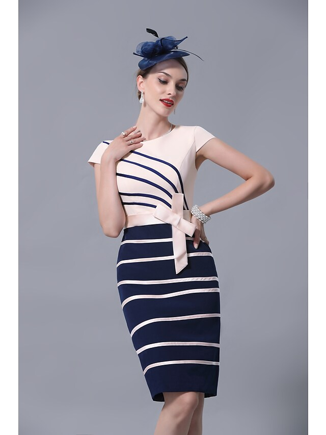 Side view of a sophisticated knee-length satin dress.