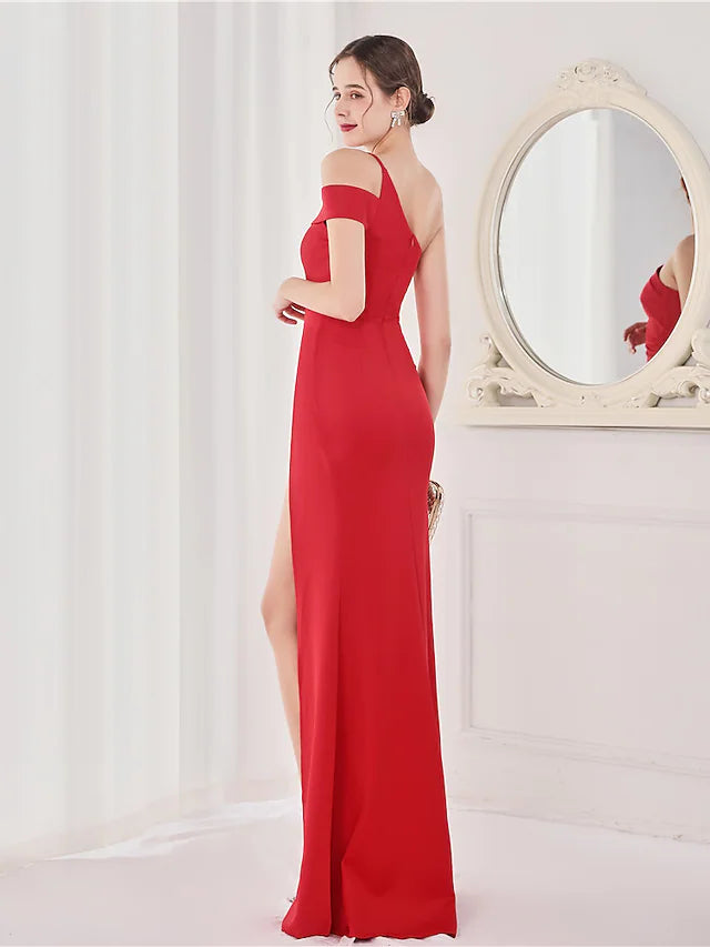 Back view of satin mermaid gown with V-back and high slit.