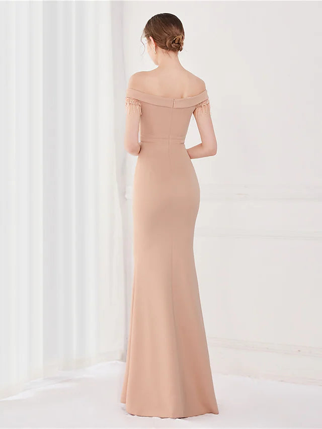 Close-up of the off-shoulder neckline and short sleeves of the satin formal evening dress.