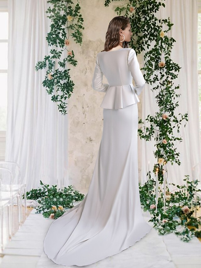Back view of the satin sheath wedding dress showing the court train and appliques.