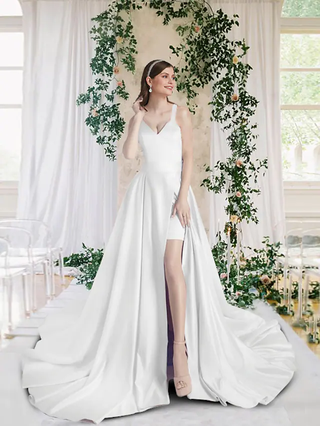 Elegant V-neck satin wedding dress with chapel train and split front.