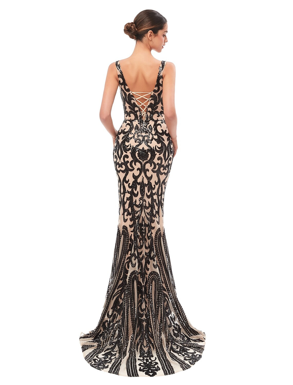 Woman posing in the elegant V-neck sequin evening dress.