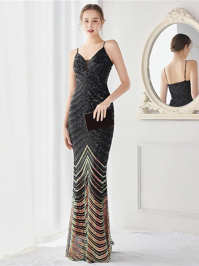 Elegant sequined mermaid trumpet evening gown with spaghetti straps.