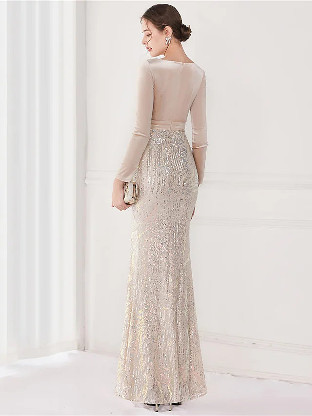 Back view of sequined mermaid trumpet gown showing V-back and slit detail.