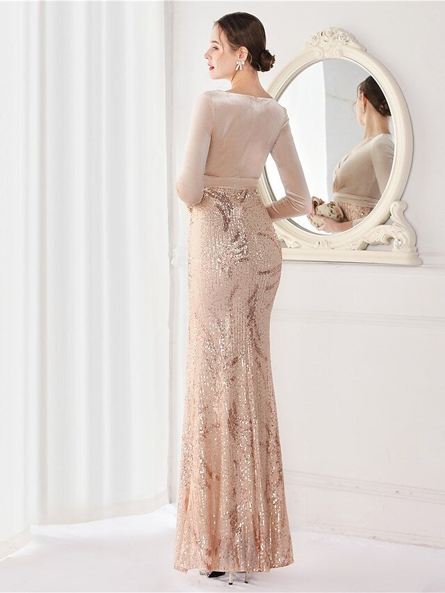Model showcasing the flowing silhouette of a sequined long sleeve gown.