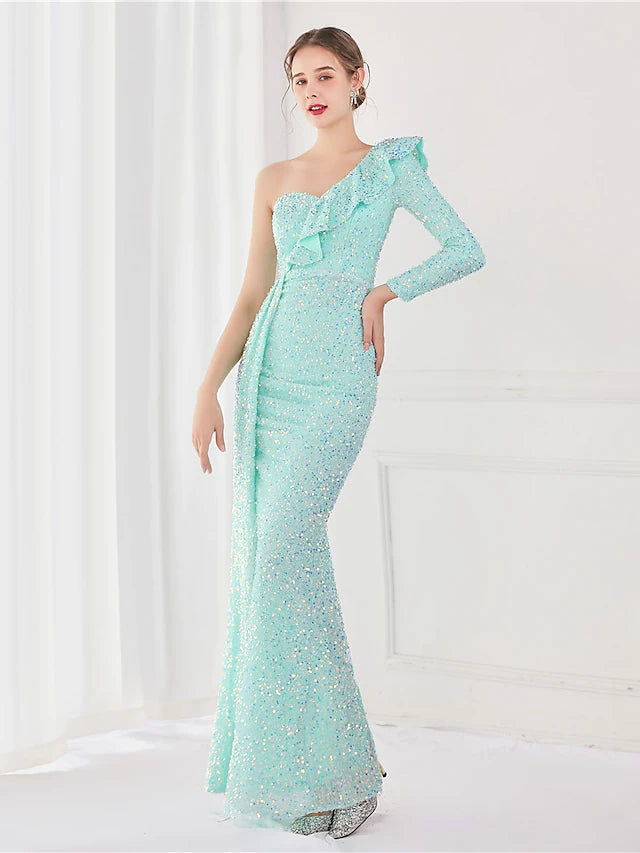 Full length view of the sequined one-shoulder long sleeve evening gown.