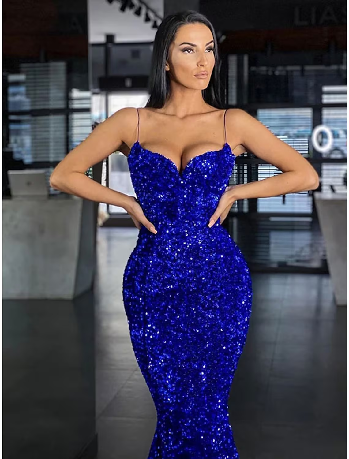 Back view of the sequined mermaid trumpet maxi prom dress, showcasing the sweep train.