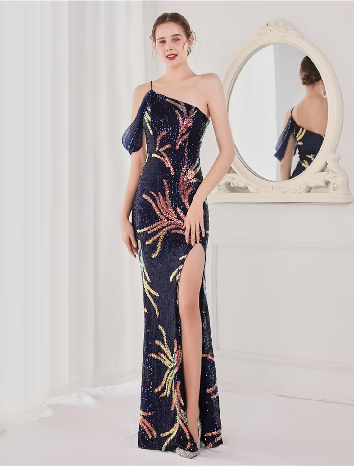 Elegant sequined mermaid trumpet evening gown with spaghetti straps.