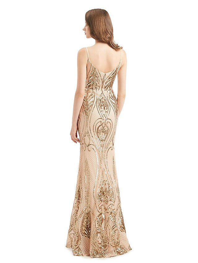 Woman posing in the sleeveless sequined trumpet gown.