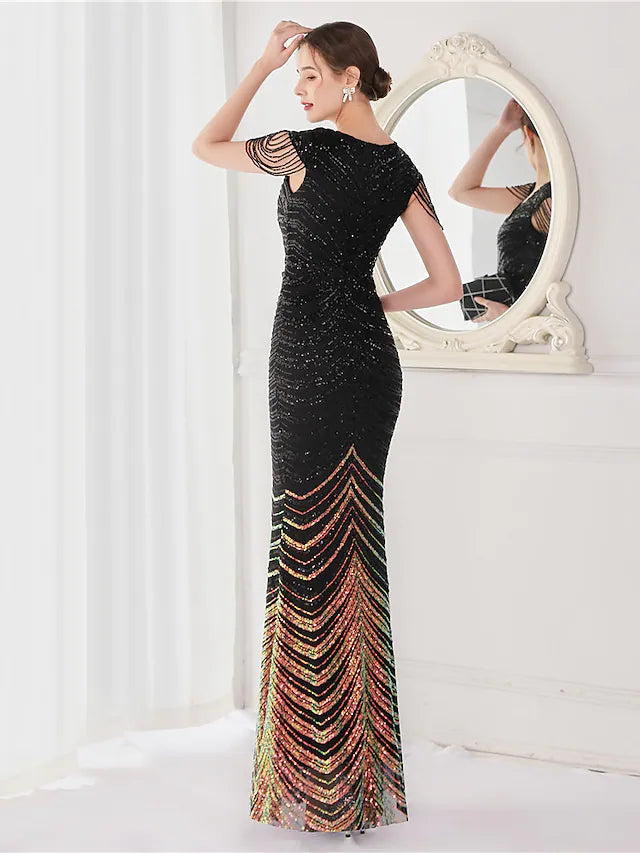 Close-up of the sequined fabric and V-neckline of the evening gown.