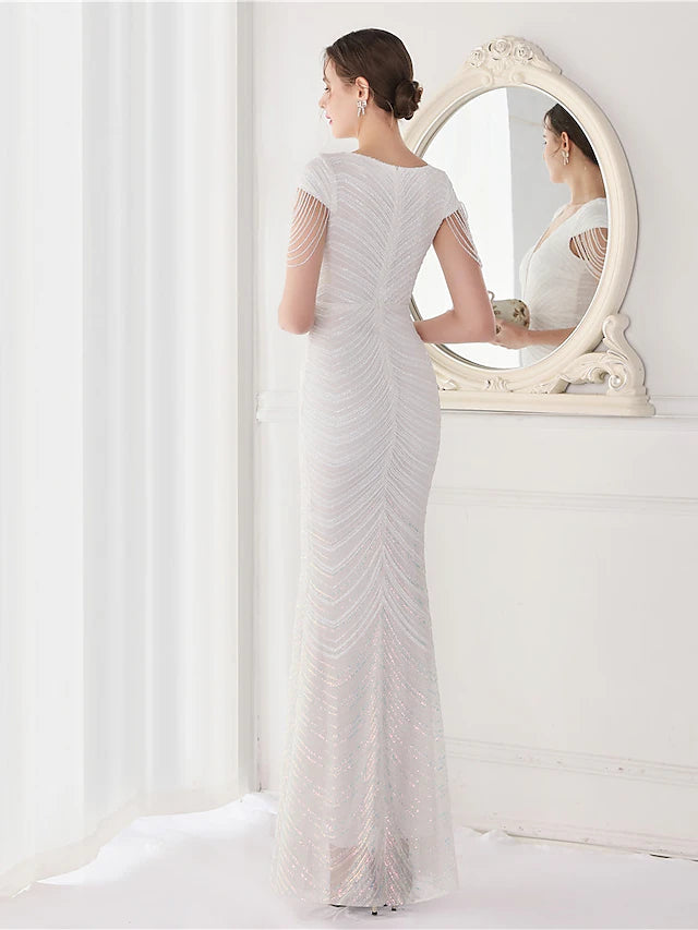 Side view of the floor-length sequined mermaid dress.