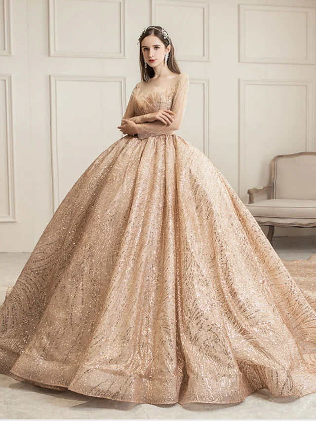 Luxurious sequined tulle ball gown wedding dress with jewel neck and long sleeves, featuring a chapel train.