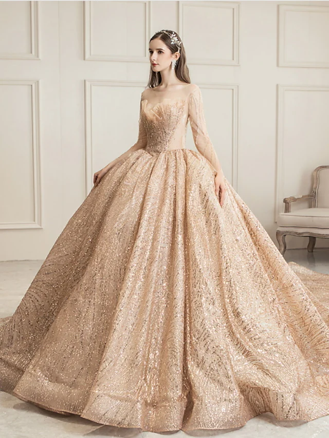 Side profile of the princess ball gown wedding dress, showcasing sequin details and long sleeves.