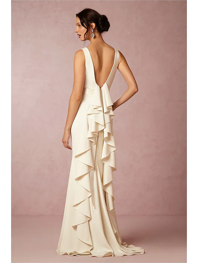 Side view of a draped white satin wedding gown with regular straps.