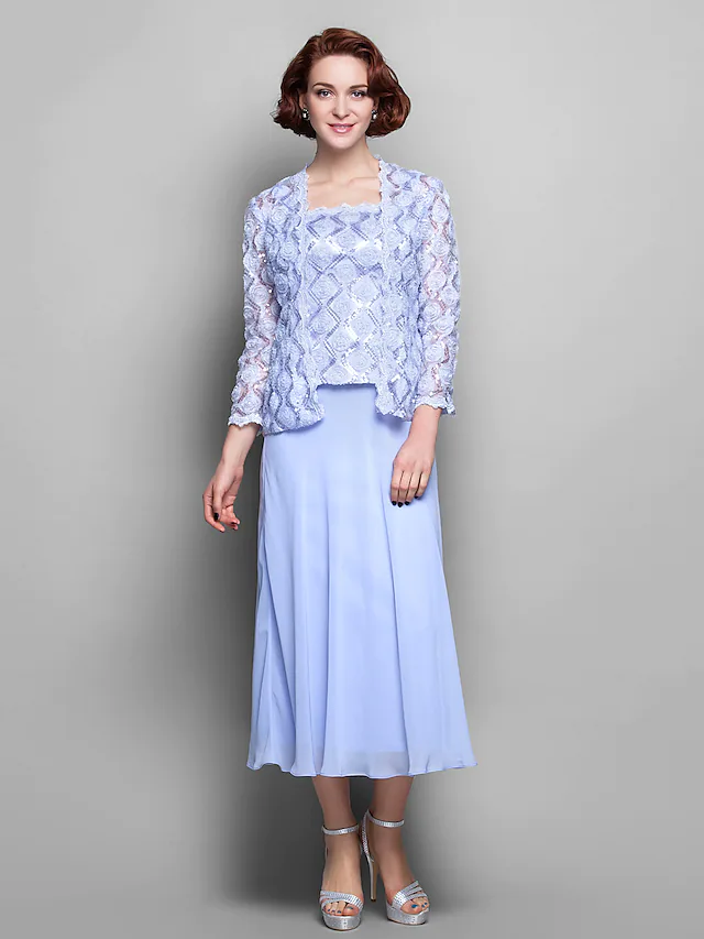 Elegant tea-length Mother of the Bride dress with wrap and long lace sleeves.