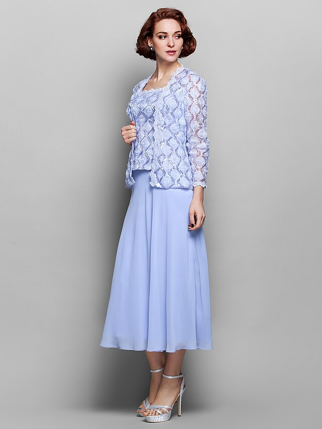 Side profile of the Mother of the Bride gown, showcasing its silhouette and long sleeves.
