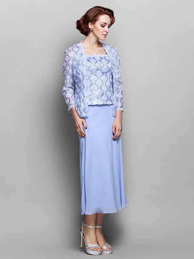 Back view of the elegant tea-length dress with lace details.
