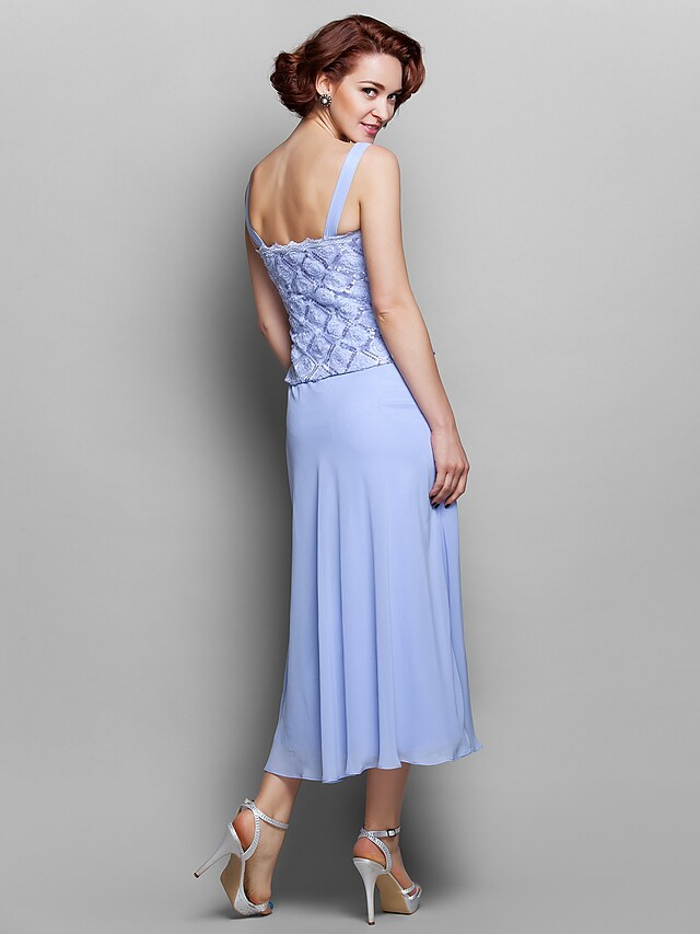 Close-up of the delicate lace long sleeves on the dress.