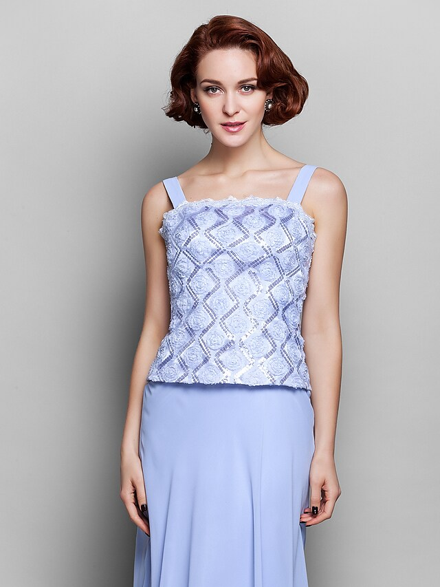 Fabric detail showing chiffon and lace textures of the dress.