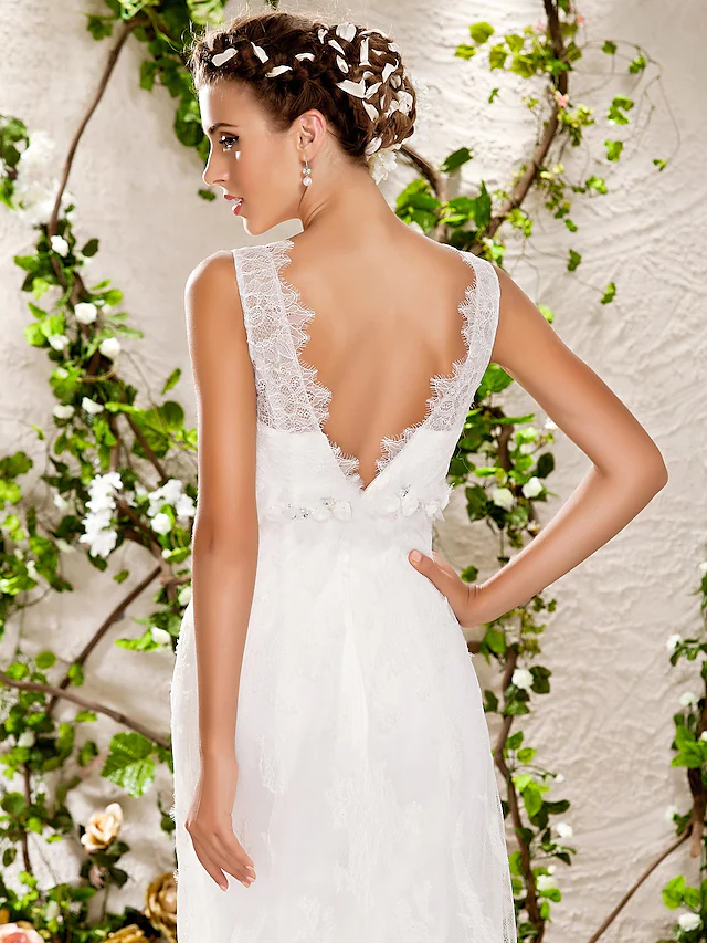 Bride walking, highlighting the flowing chapel train of the wedding dress.