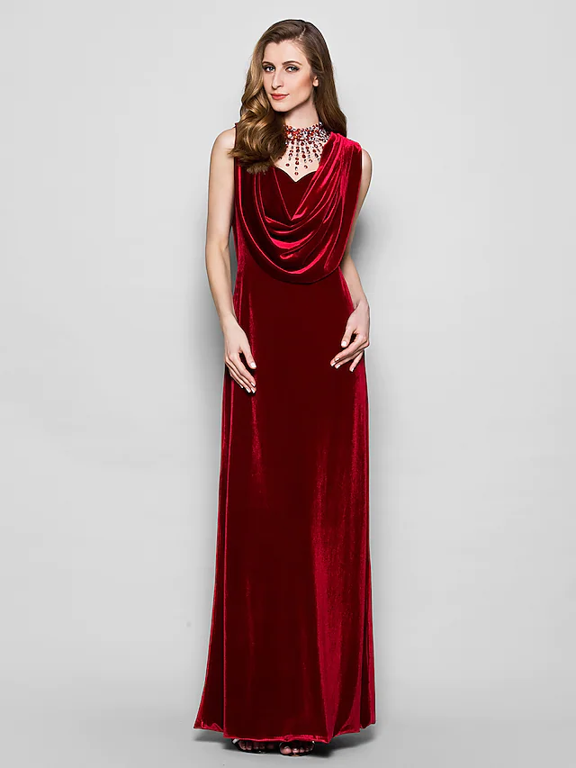 Close-up of the cowl neck and crystal beading on the dark velvet dress.