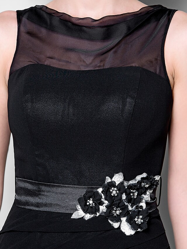 Formal gown with cowl neck and sleeveless design.