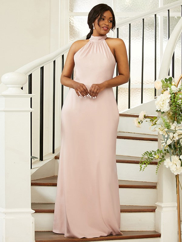 Plus size model wearing an elegant ruched halter neck floor-length satin-like bridesmaid dress.