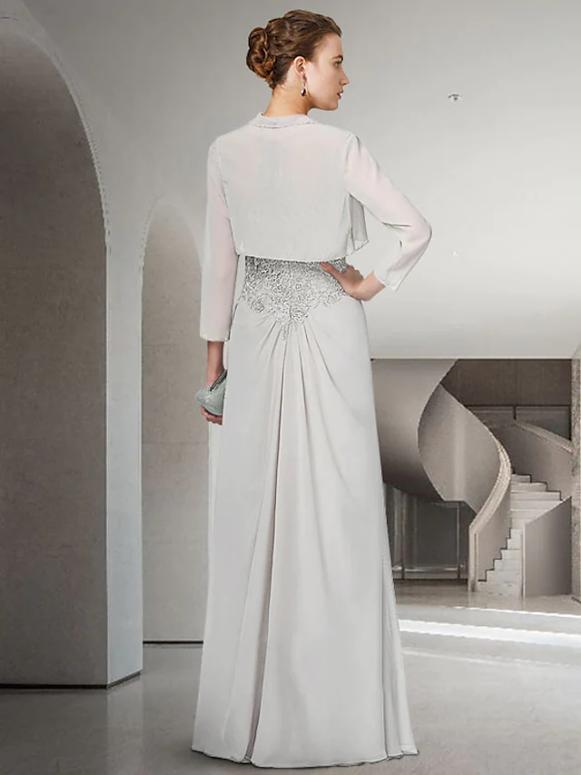 Back view of the floor-length Mother of the Bride gown featuring ruffles and appliques.