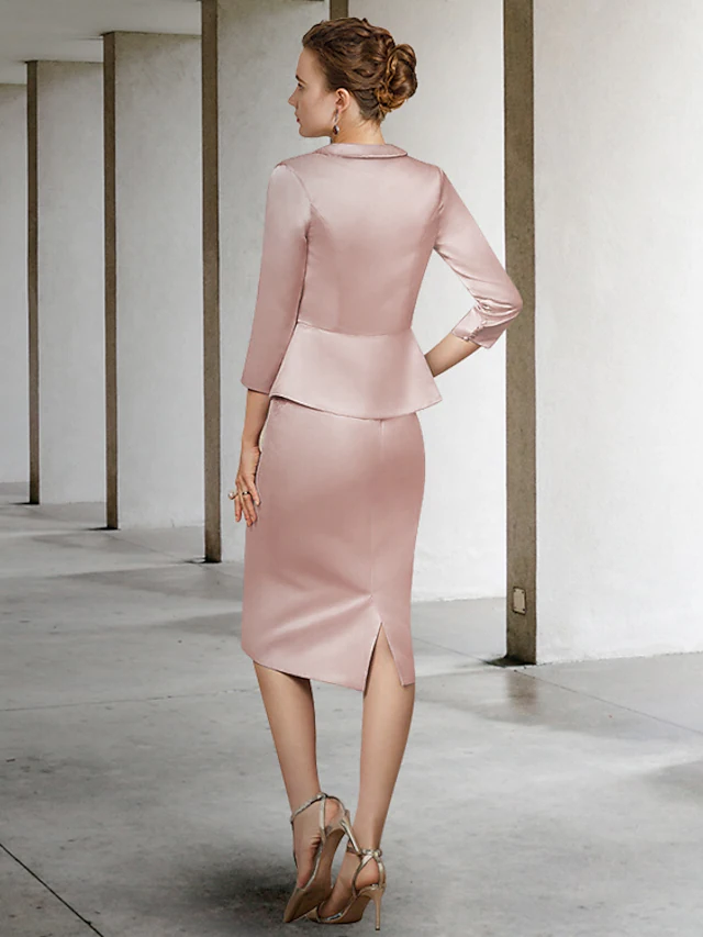 Full view of the elegant light blue two-piece Mother of the Bride dress, showcasing its knee-length design.