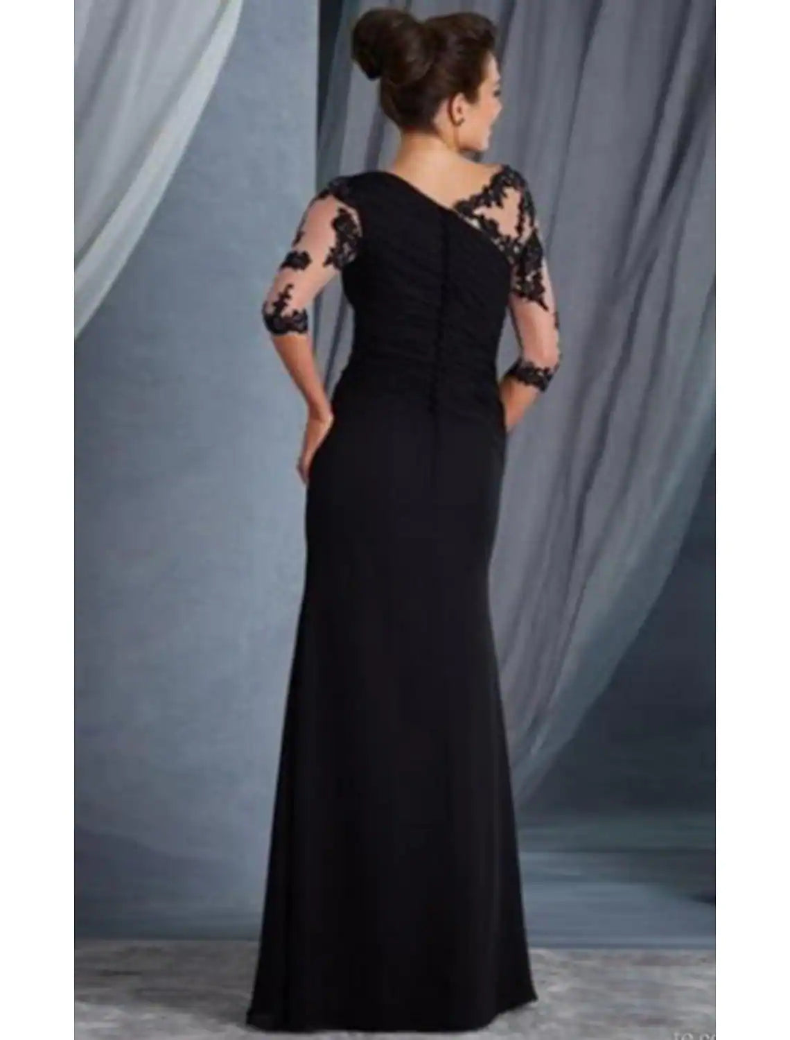 Close-up view of the intricate lace and applique details on the elegant evening dress.