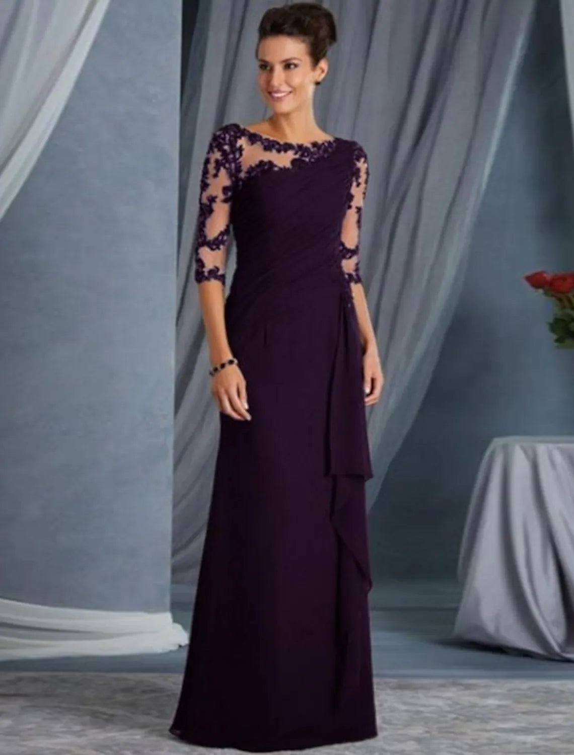 Back view of the floor-length sheath dress, showcasing its elegant silhouette and design.
