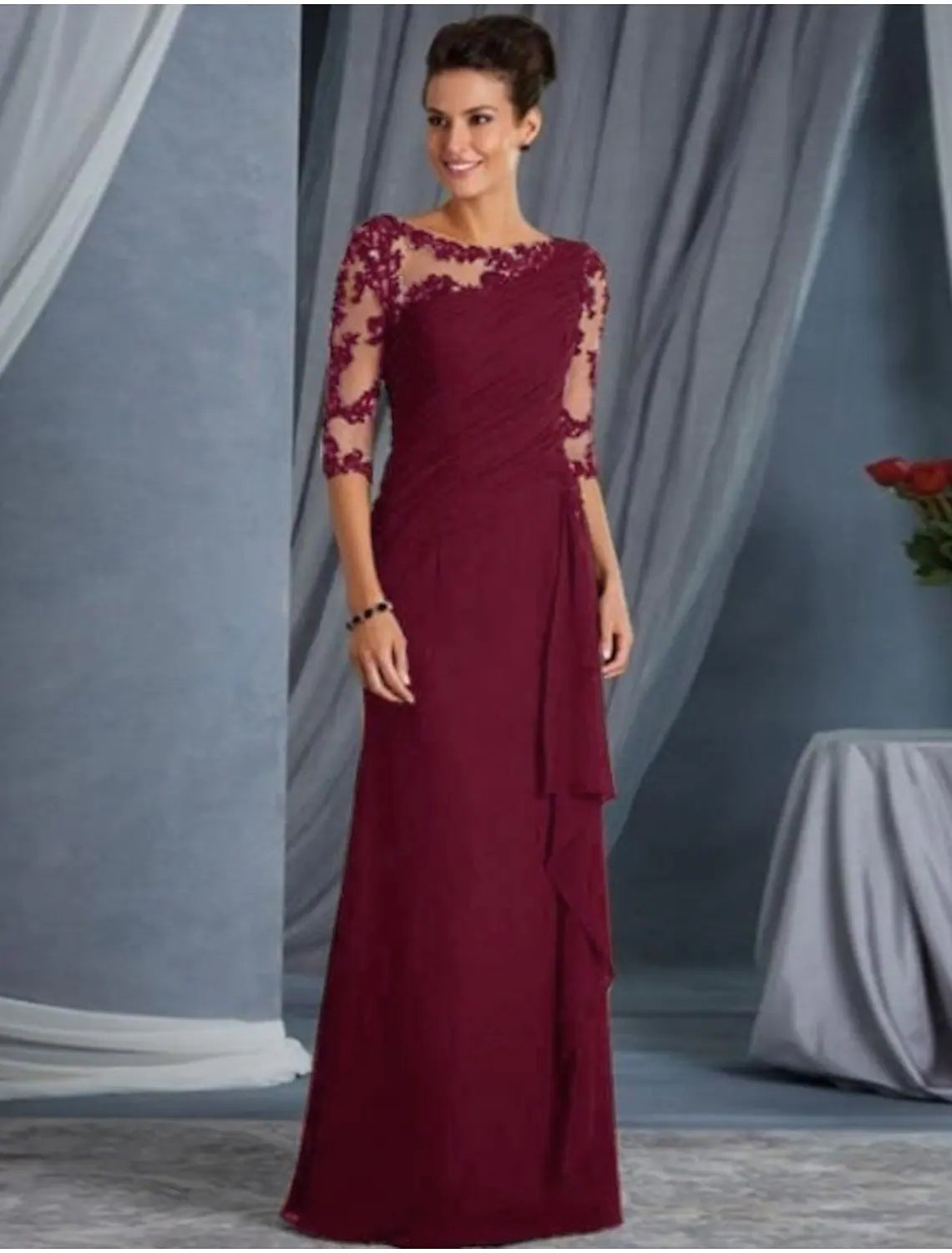 Full view of the elegant lace evening dress, highlighting its floor-length design and appliques.