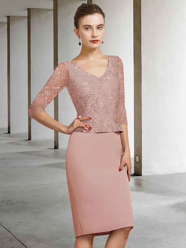 Woman wearing an elegant knee-length, half-sleeve, jewel-neck lace sheath dress with appliques.