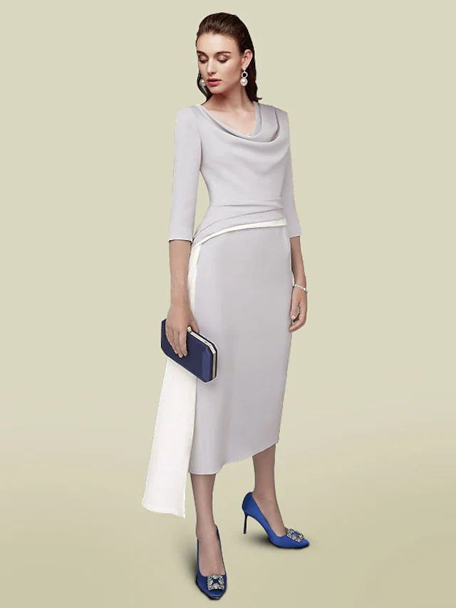 Elegant dark blue tea-length mother of the bride dress with jewel neck, half sleeves, and ruching.