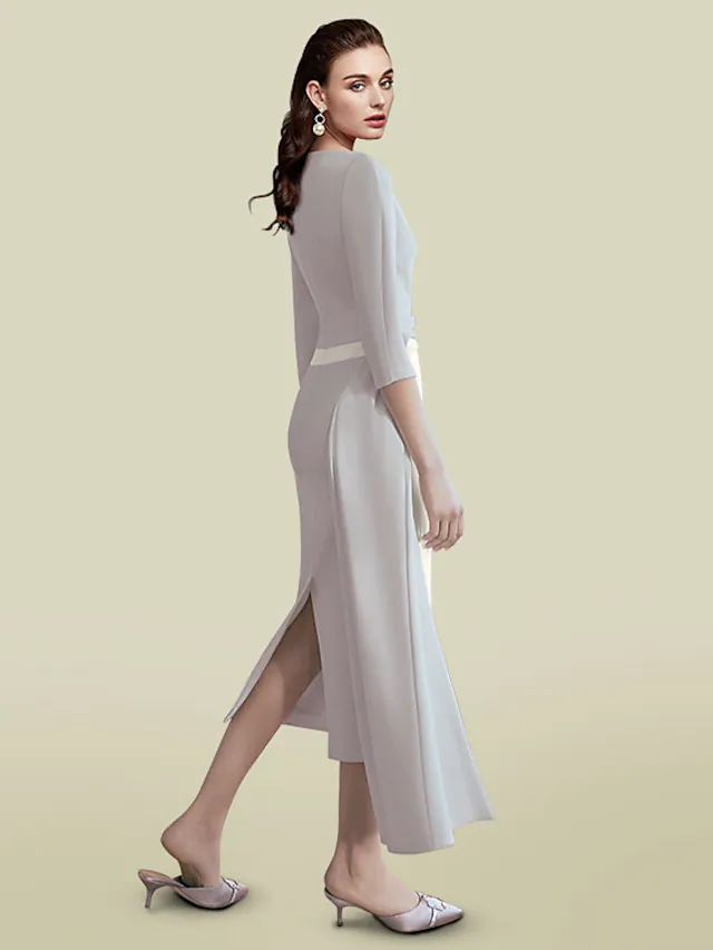 Side view of the dark blue sheath mother of the bride dress, highlighting ruching.
