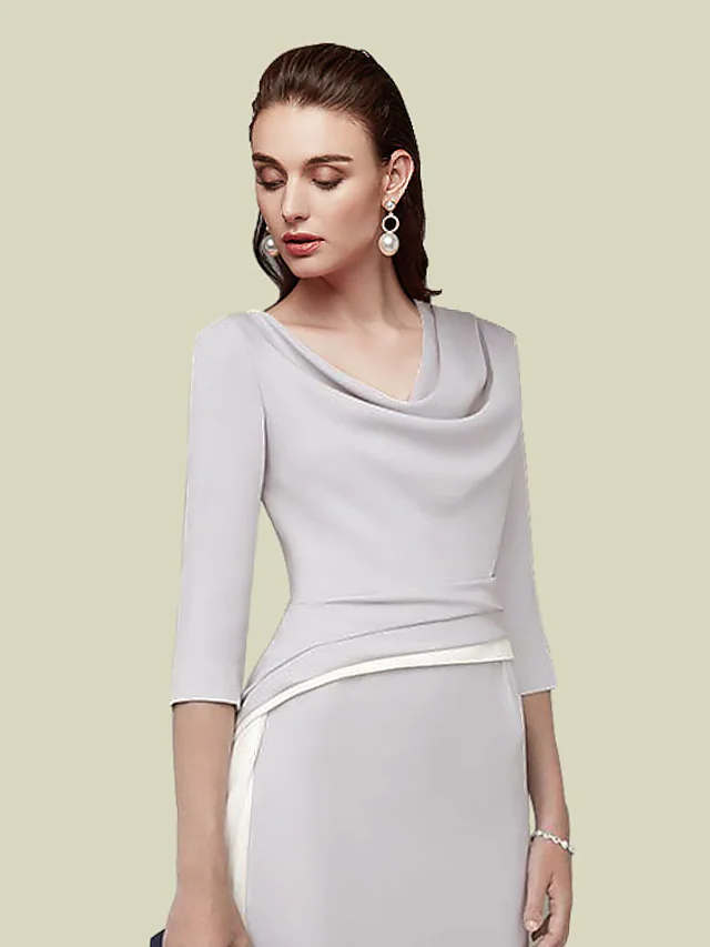 Back view of the dark blue tea-length dress, showcasing the Italy satin fabric.